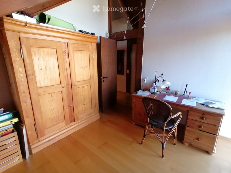 wooden floor, wooden desk, wooden chair, wooden cabinet, open door, papers on desk