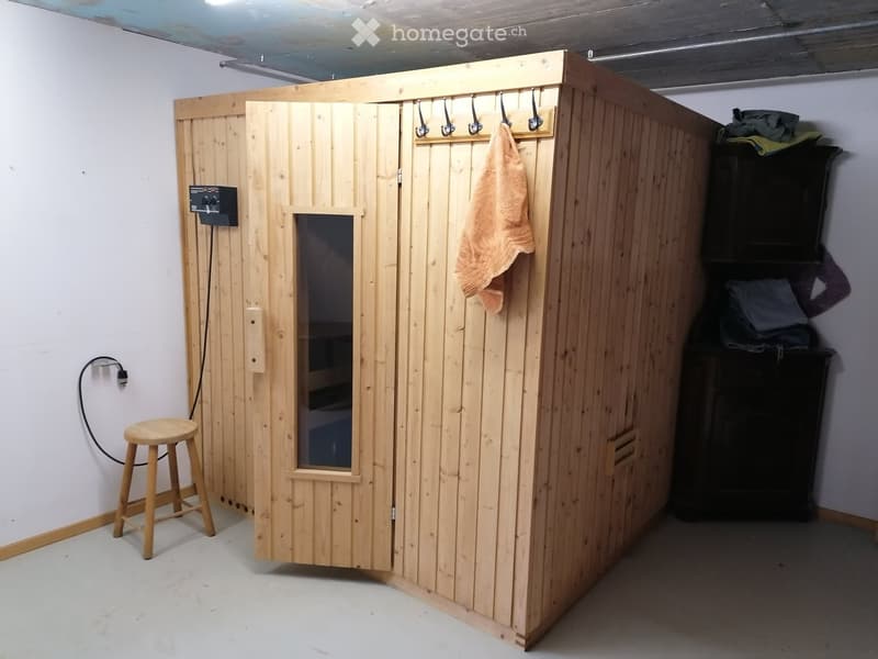 wooden sauna, wooden stool, wooden cabinet, towel hanging on the wall