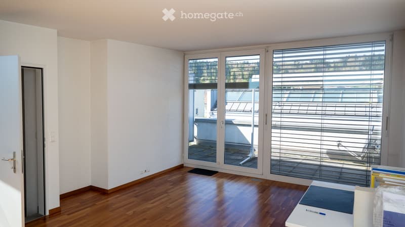 empty room, wooden floor, white walls, sliding glass doors, balcony, view of trees