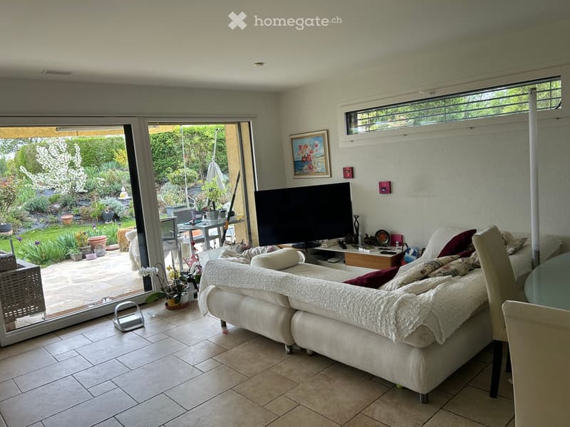 white sofa, TV, glass doors, balcony, garden view, tiled floor