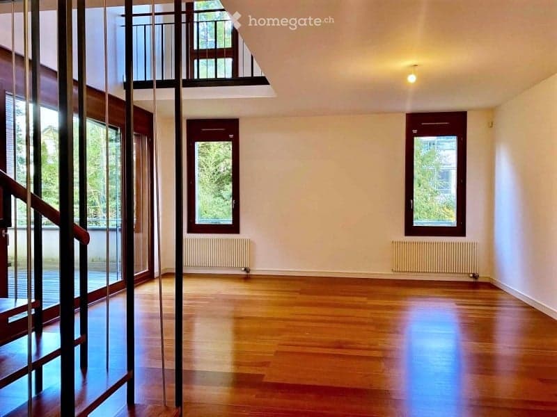 empty room, wooden floor, white walls, two windows, two radiators, balcony
