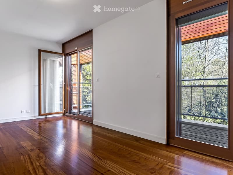 empty room, wooden floor, white walls, large glass doors, balcony