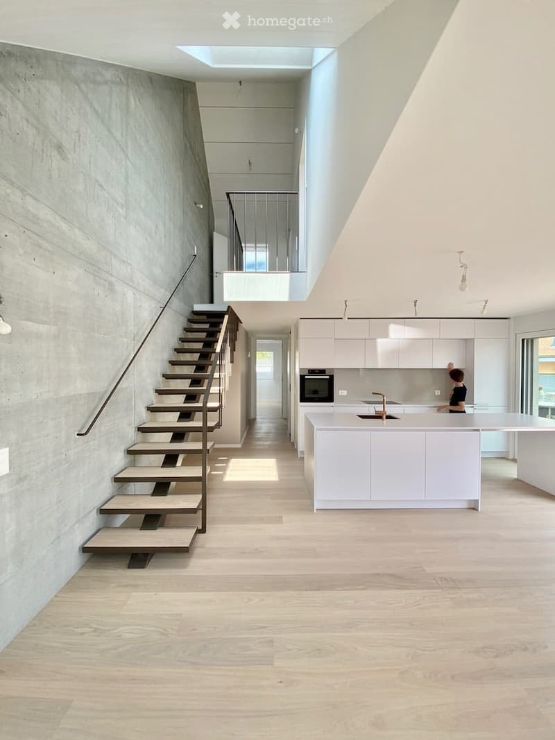 {"visible_features": ["Raised ground floor"],    "type": "Interior",    "description": "modern interior, concrete wall, wooden floor, white kitchen, staircase, balcony",    "localized_descriptions":        {        "EN": "modern interior, concrete wa