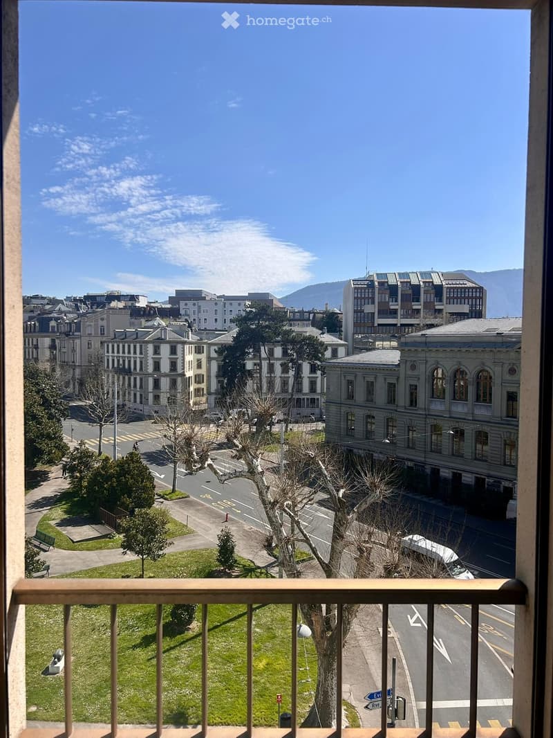 View from balcony, city view, road, buildings, trees, mountains