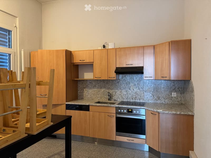 modern kitchen with wooden cabinets, granite countertops, stainless steel appliances, sink with faucet, oven, dishwasher, washing machine