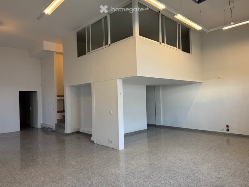 empty room, white walls, gray floor, windows, stairs, electrical outlets