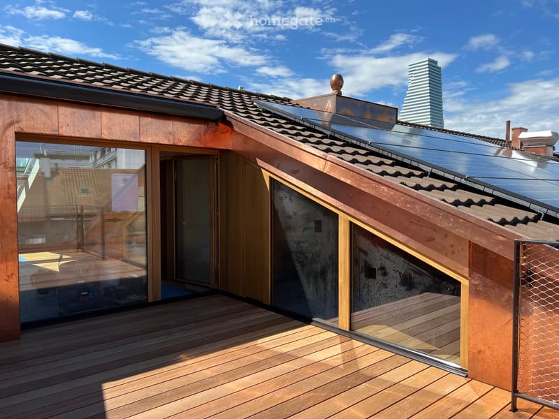 wooden exterior, copper roof, solar panels, wooden deck, glass doors, glass windows