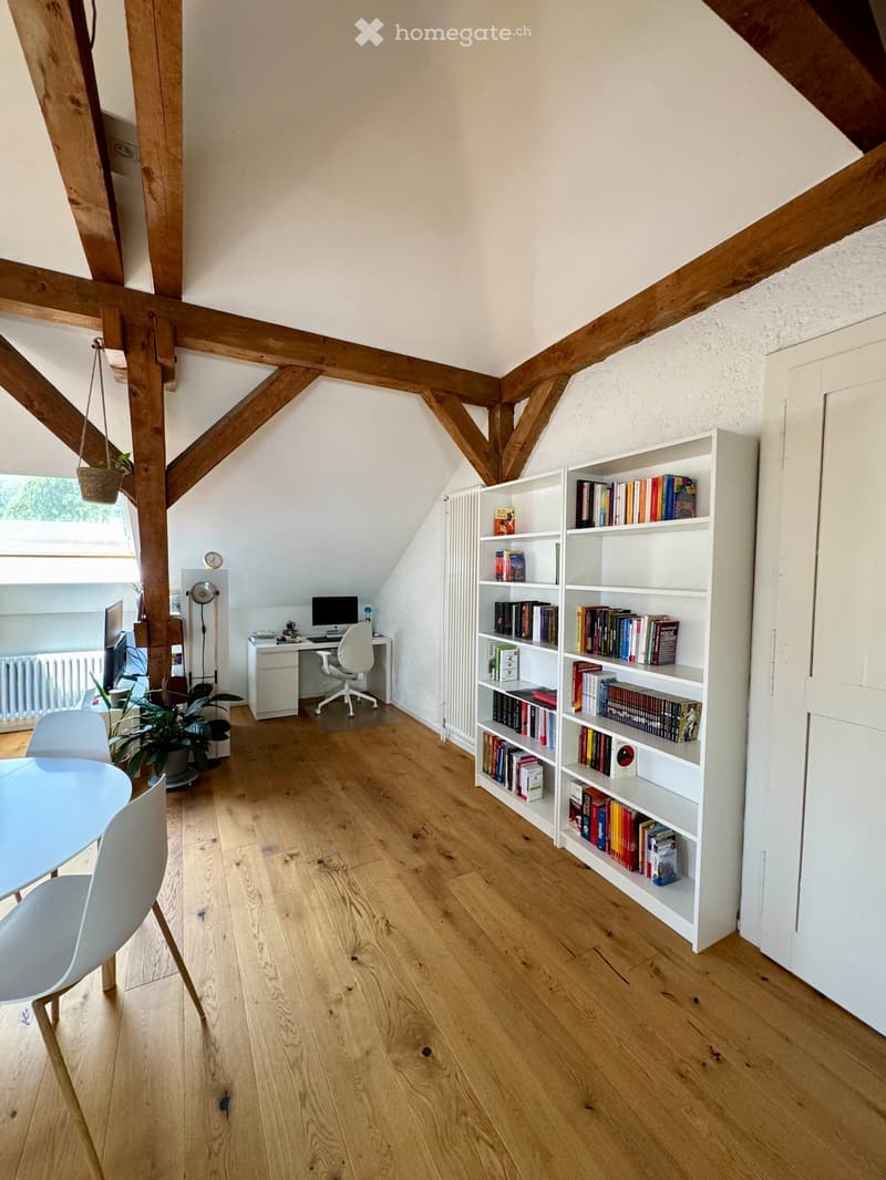 wooden floor, wooden beams, white walls, desk, chair, bookshelf, plants, table, chairs