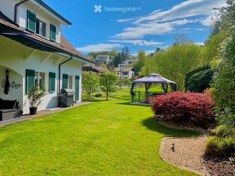 House with a garden, green lawn, gazebo, trees, and a view of the surrounding area