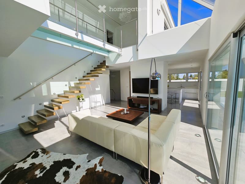modern design, white leather couch, wooden coffee table, TV, glass walls, staircase