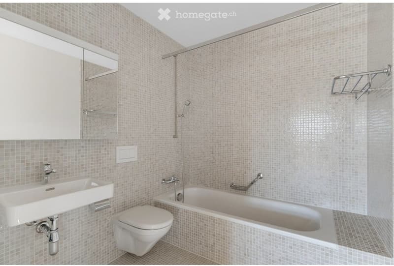 Bathroom with white tiles, white sink, white toilet, bathtub, shower, mirror, towel rack