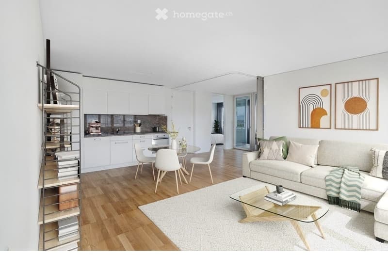 modern living room with white walls, wooden floor, white couch, glass table, dining table, white chairs, white kitchen cabinets, spiral bookshelf, white rug, artwork
