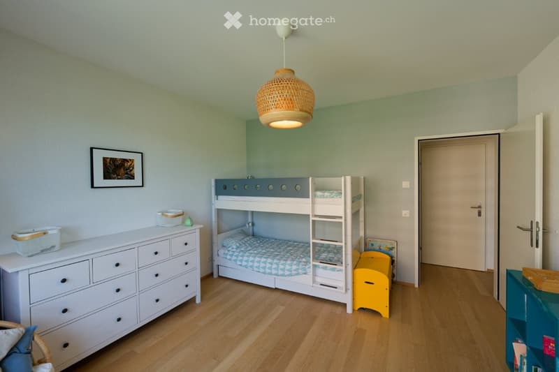 white bunk bed, white dresser, yellow storage box, picture frame, wicker basket, lamp