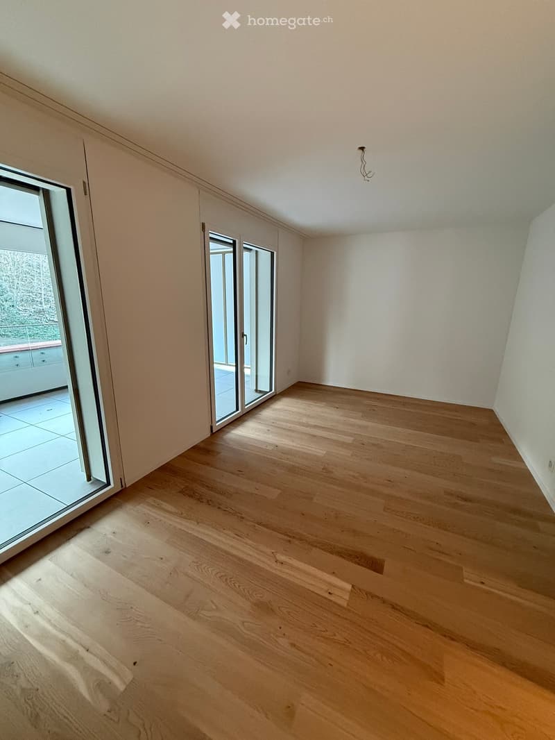 empty room, wooden floor, sliding glass doors, balcony, white walls