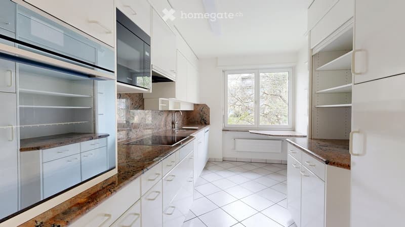 modern kitchen with white cabinets, granite countertops, built-in oven, microwave, dishwasher, sink, faucet, window