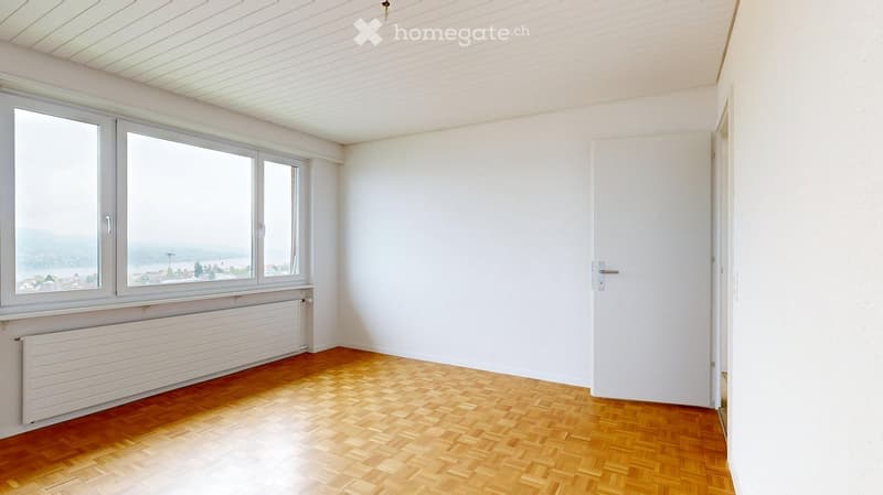 empty room, wooden floor, white walls, large windows, radiator