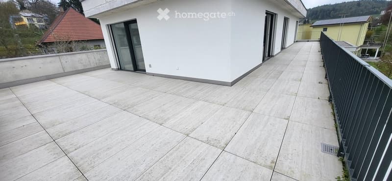 tiled floor, black railing, glass doors, white walls