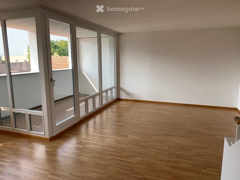 empty room, wooden floor, large glass doors, balcony, white walls, power outlets