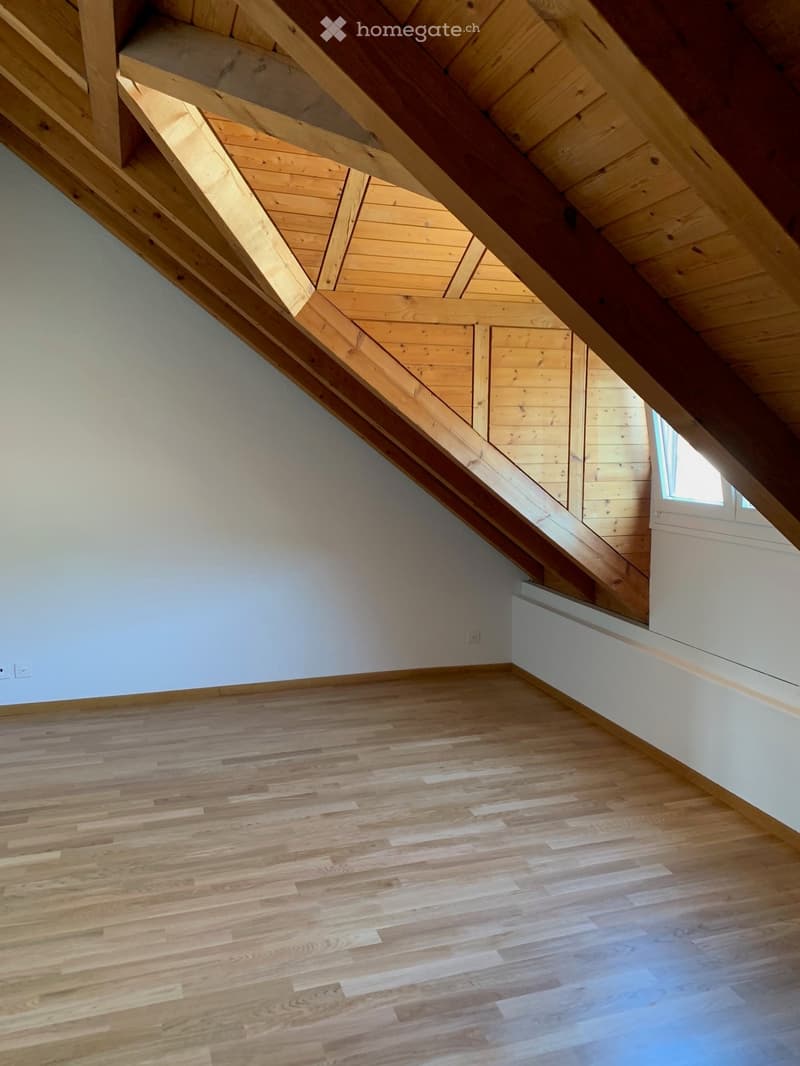 empty room, wooden floor, wooden ceiling, white walls, small window