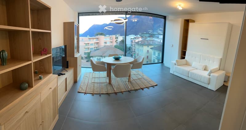 living room, dining table with 4 chairs, carpet, couch, flatscreen television, wooden cabinet
