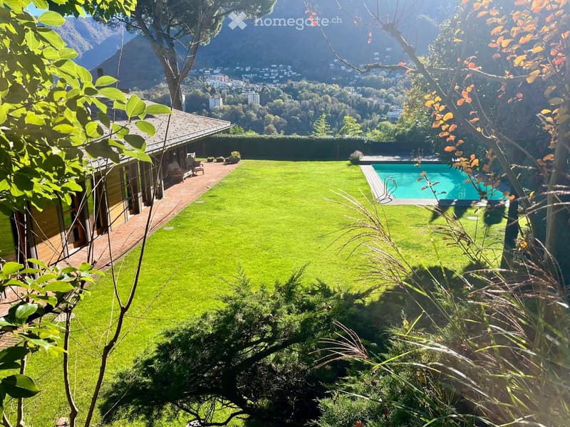 well-maintained lawn, swimming pool, patio with outdoor furniture, beautiful view of mountains
