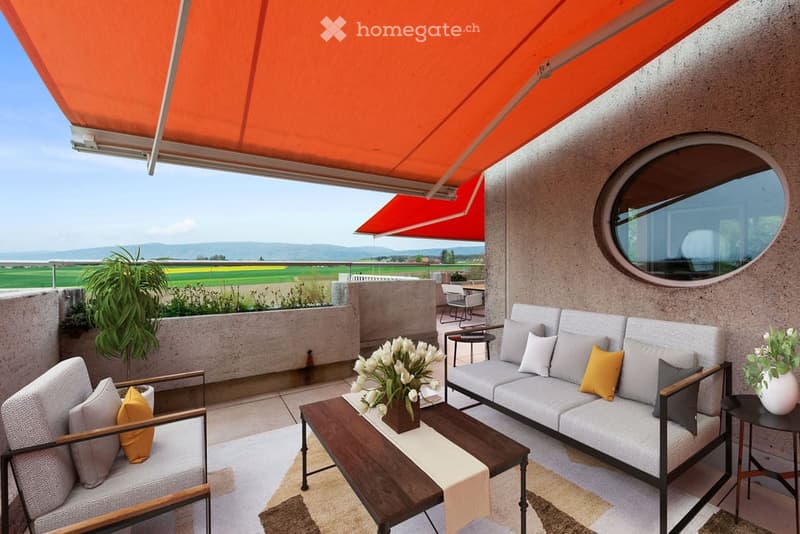 modern terrace with furniture, flowers, and a view of the landscape