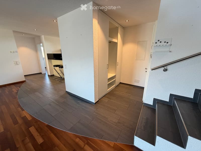 modern interior, wooden floor, white walls, white built-in wardrobe, curved staircase, open doorway