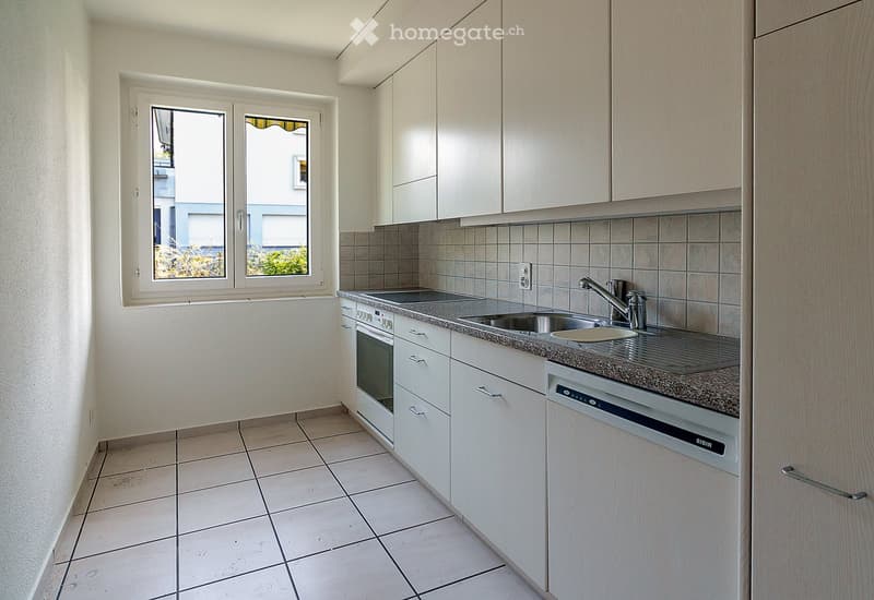 kitchen, white cabinets, tiled floor, sink, dishwasher, oven, window