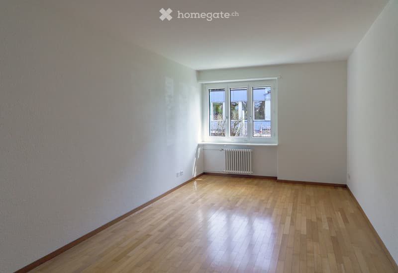 empty room, white walls, wooden floor, window, radiator