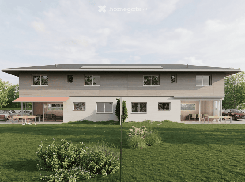 House. Modern two-story house with large windows, flat roof, and covered outdoor seating areas. The house is surrounded by a well-maintained lawn and garden.