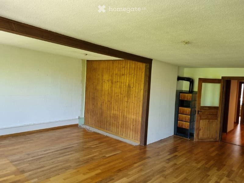 empty room, wooden floor, white walls, wooden paneling, wooden cabinet, open door