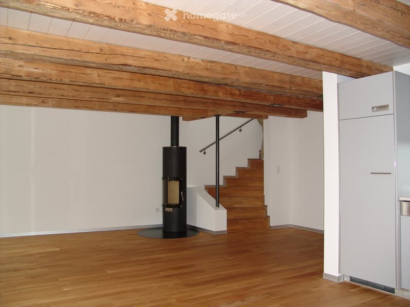 wooden floor, wooden ceiling, fireplace, staircase, white walls