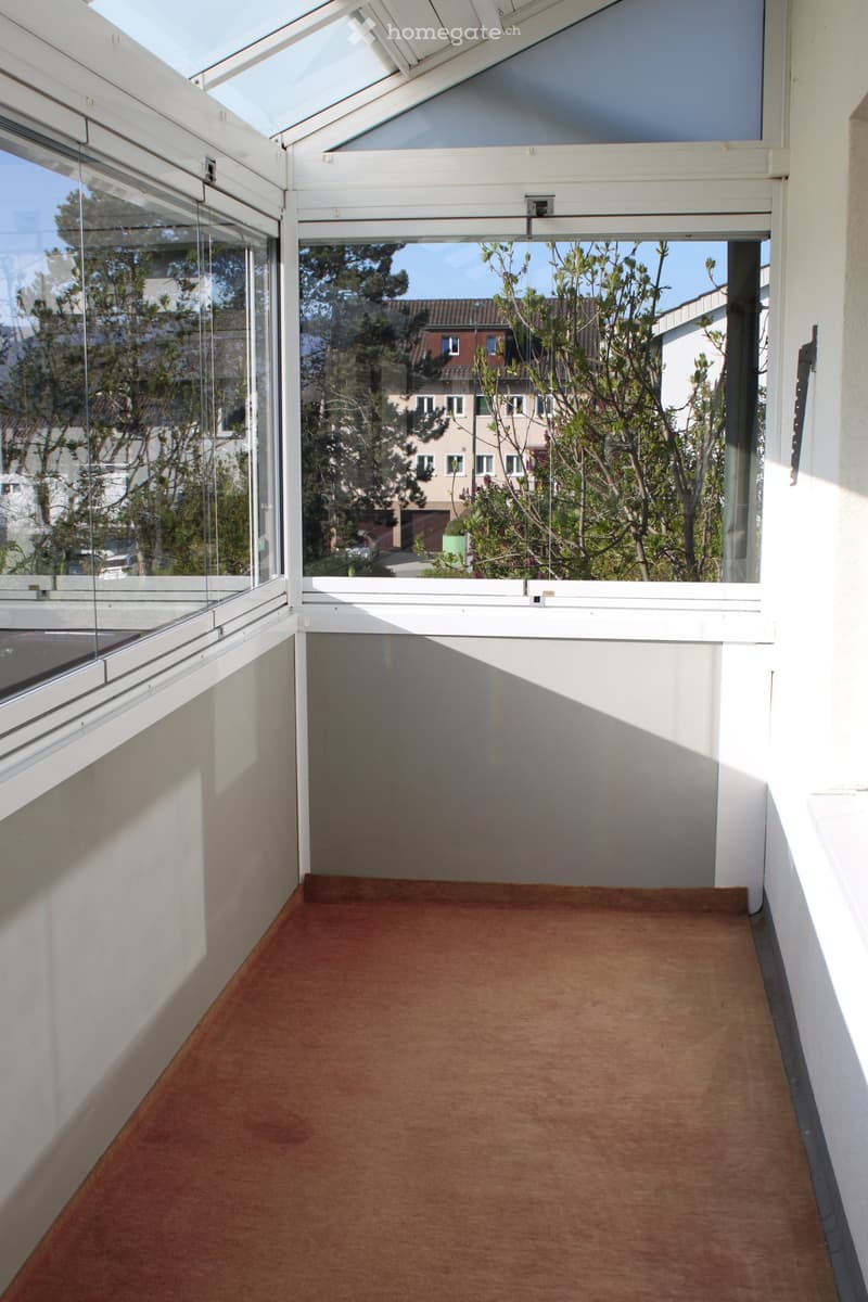 glass walls, glass roof, brown floor, white walls