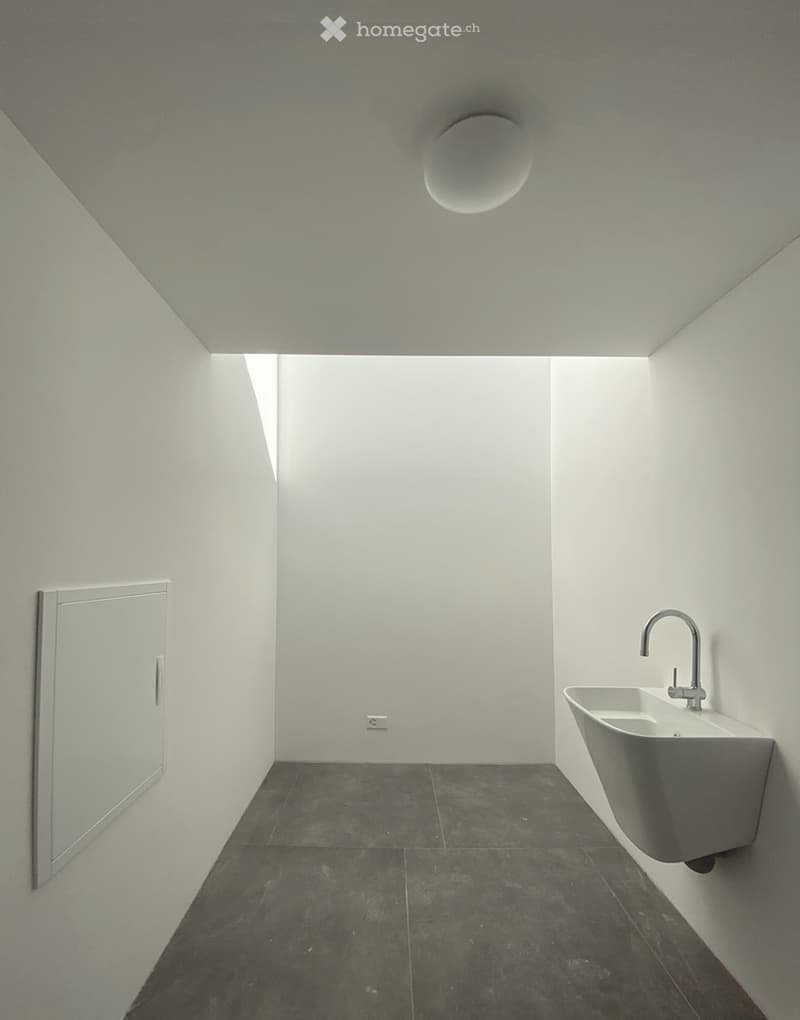 white wash basin, faucet, light on ceiling, power outlet, square tiled floor, corner of room