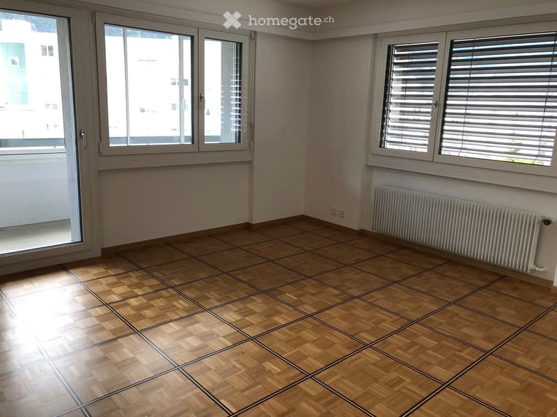 empty room, wooden floor, white walls, large windows, balcony, radiator