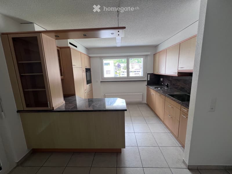 modern kitchen with island, wooden cabinets, granite countertops, built-in oven, sink, and dishwasher