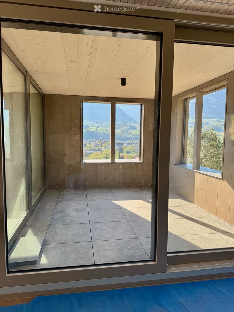 large windows, balcony, tiled floor, wooden ceiling, mountain view