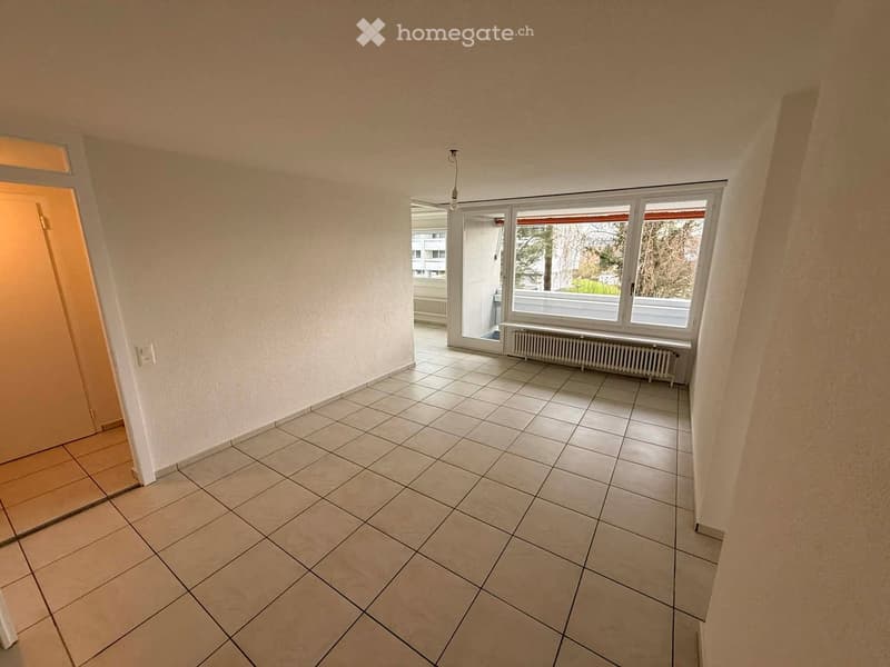 empty room, white walls, tiled floor, large window, balcony