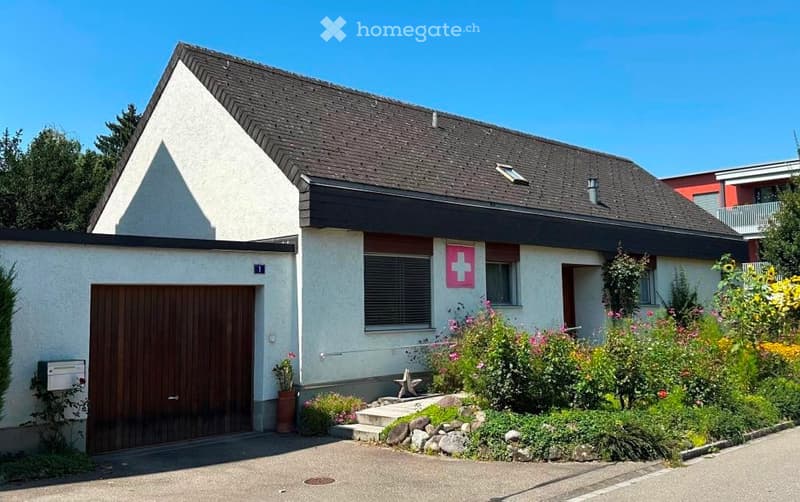single family house, white paint, brown roof, wooden garage door, garden, flower beds
