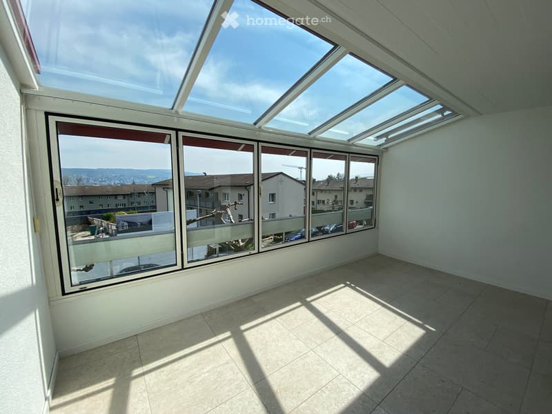 large windows, tiled floor, skylight, view of the city