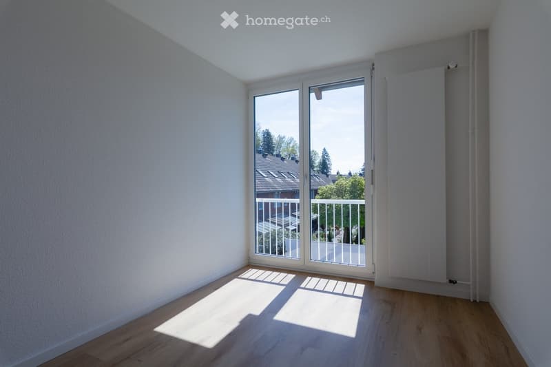 empty room, white walls, wooden floor, sliding glass door, balcony
