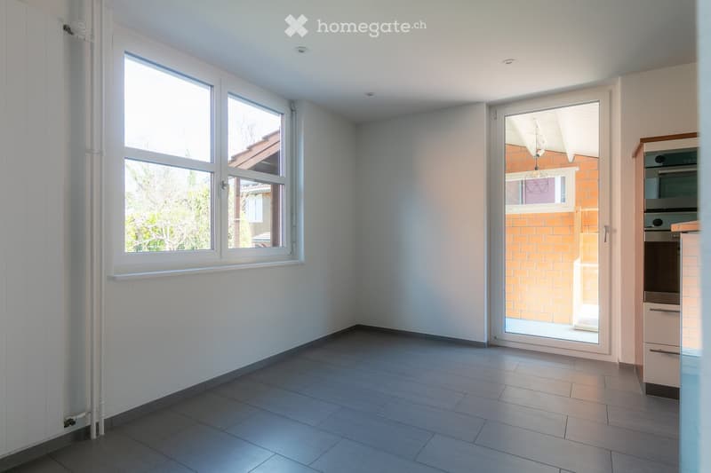 empty room, white walls, gray floor, two windows, glass door