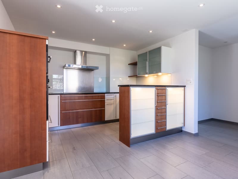 modern kitchen with wooden cabinets, stainless steel appliances, tiled floor, white walls, ceiling lights