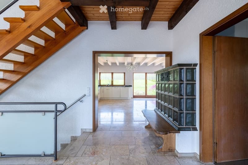 marble floor, wooden stairs, wooden bench, wooden cabinet, kitchen with white cabinets and windows