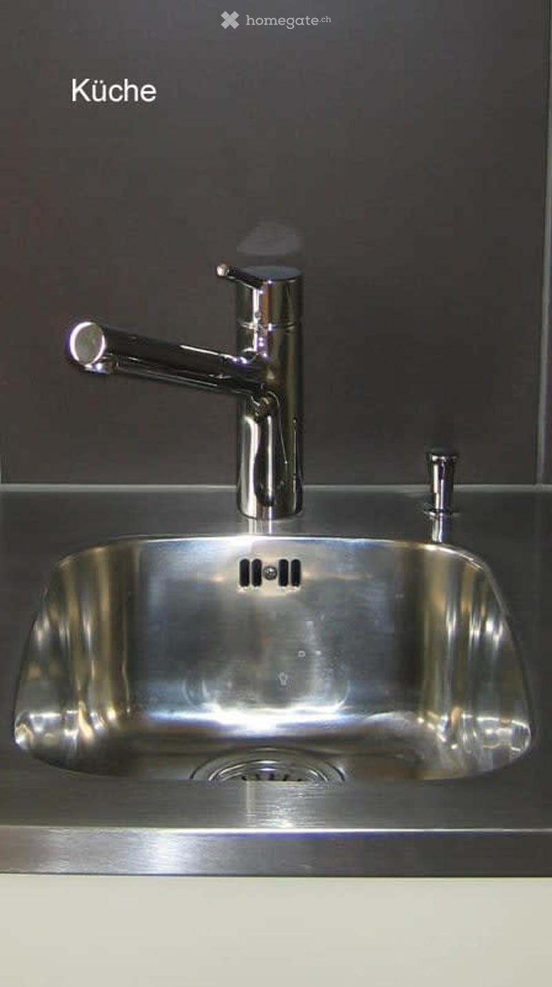 Stainless steel sink with chrome faucet and drain