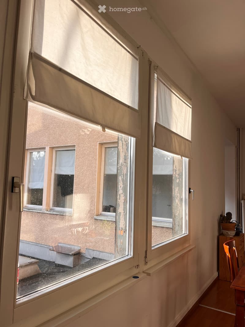 large window with view of building outside