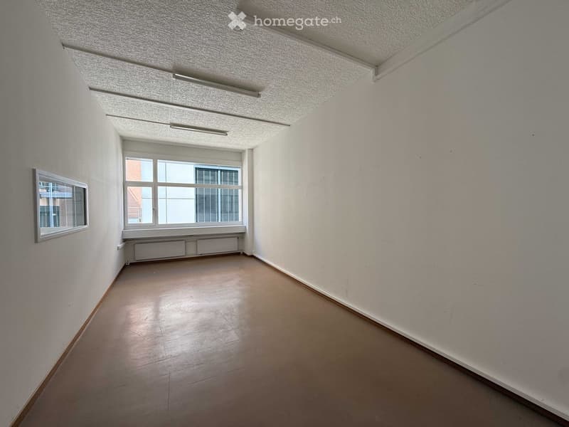 empty room, white walls, brown floor, large window, ceiling lights