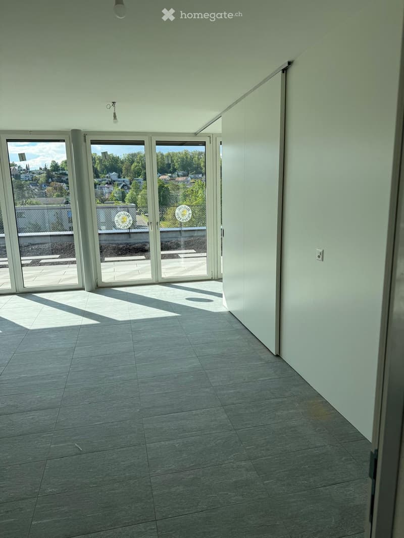 empty room, sliding glass doors, balcony, tiled floor, white walls, ceiling lights