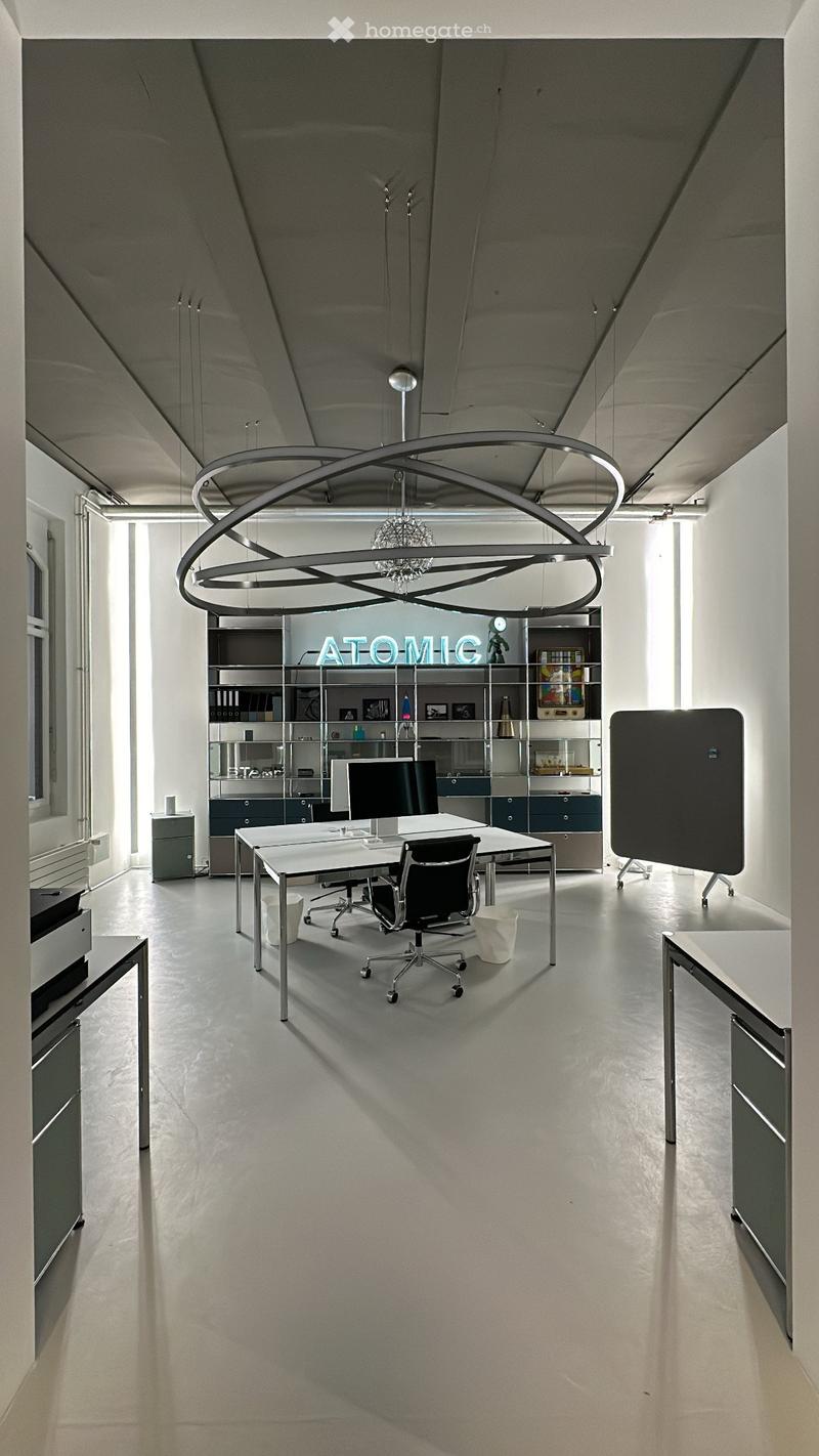 modern office with white walls, gray floor, large desk, office chairs, shelves, monitor, keyboard, mouse, trash bin, cabinet, glass window, neon sign