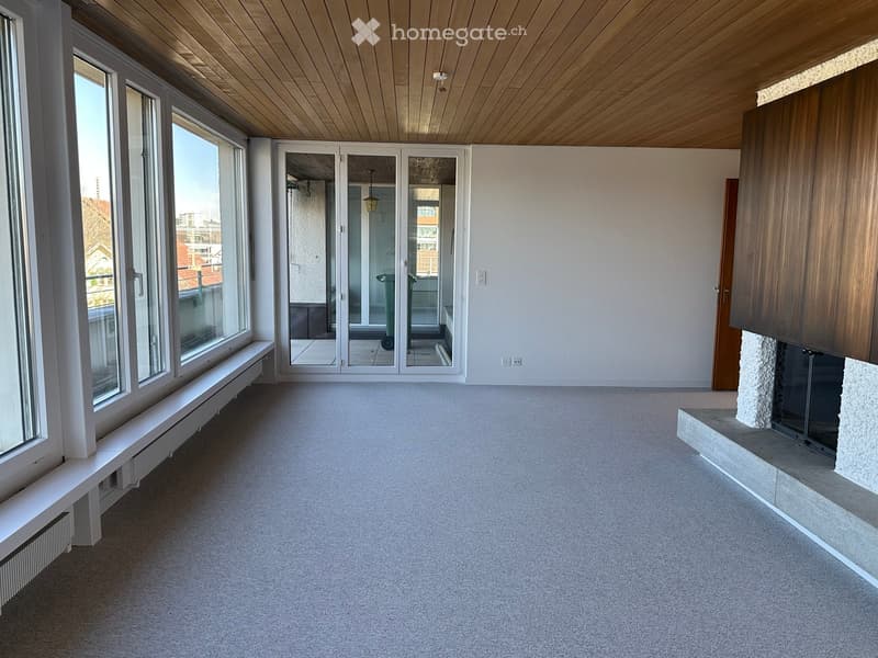 empty room, large windows, sliding glass doors, fireplace, balcony, wooden ceiling